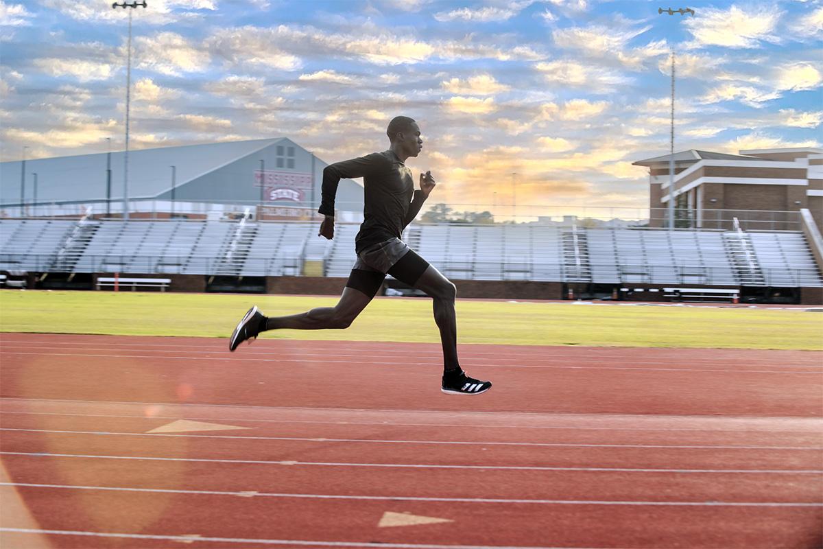 A sprinter on a track at MSU