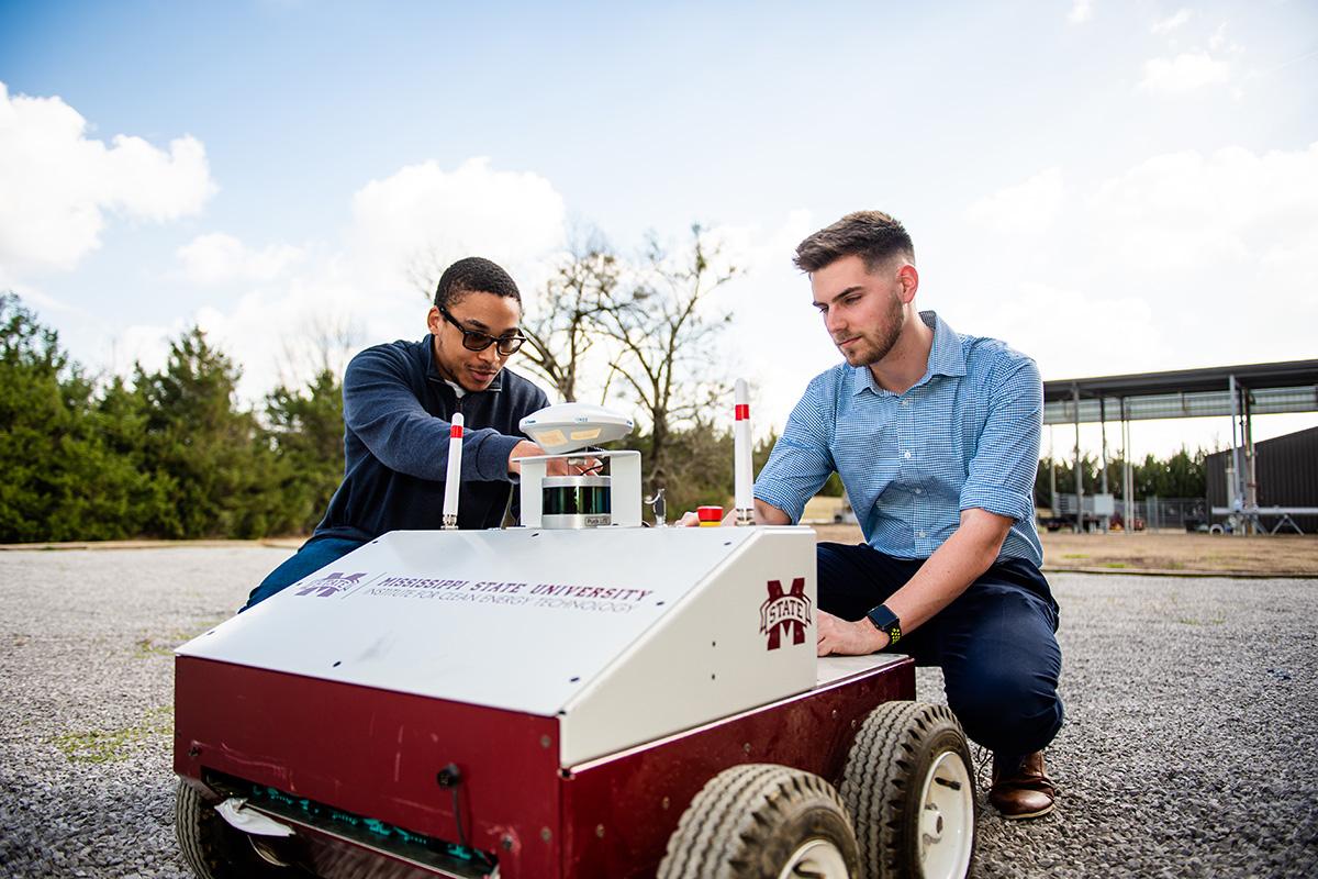 Researchers work with a drone
